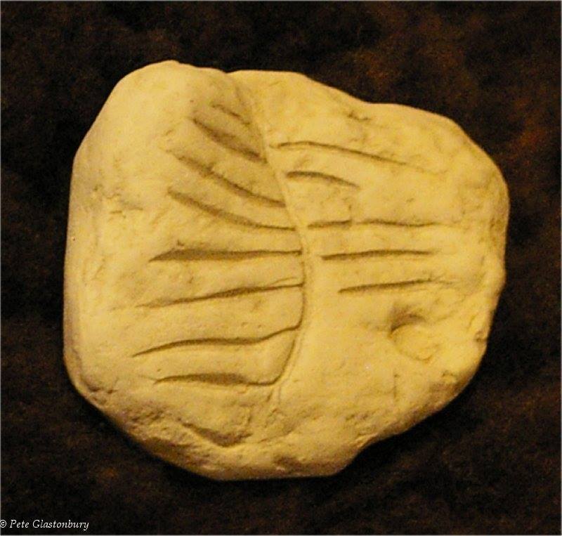 Chalk amulet with incised designs from Windmill hill near Avebury Wiltshire